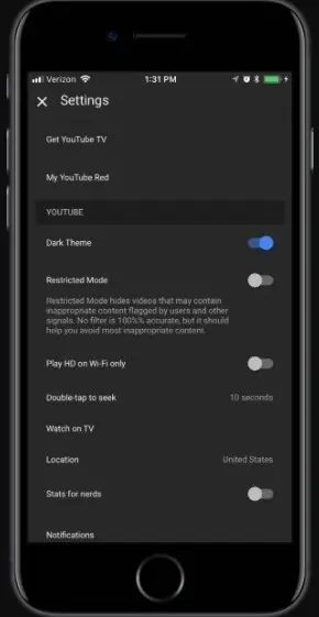 You can enable the dark mode through the dark theme introduced on iOS 13
